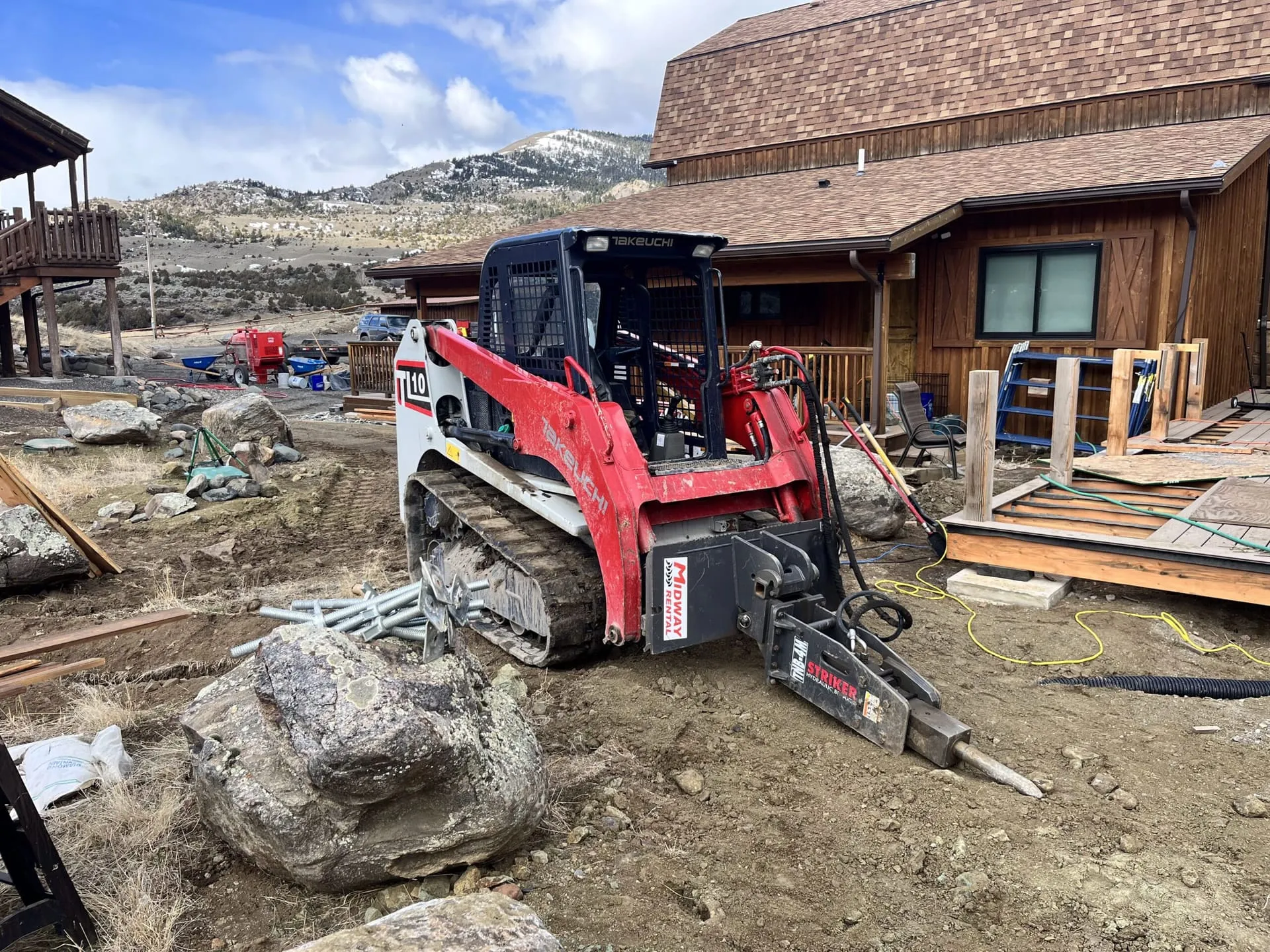 Excavation equipment preparing ground on a Montana property